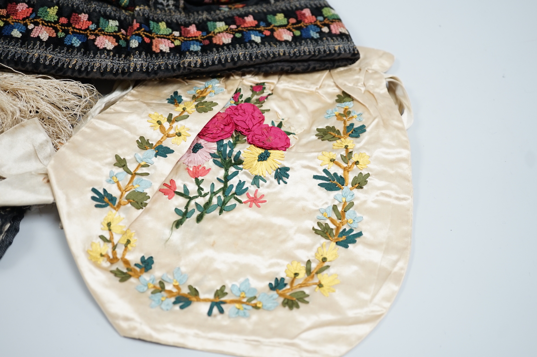 A 19th century Indian net embroidered silk floss stole, a black velvet silk cross stitch embroidered hat and a cream satin ribbon worked ladies bag, stole 240cm long, 57cm wide